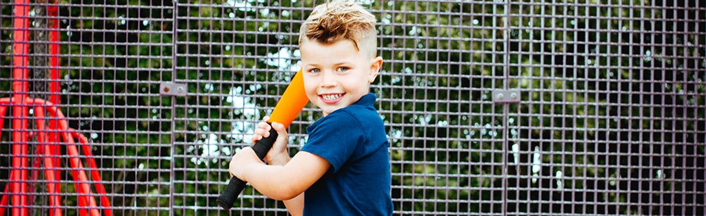 Baseball in the UK 1 Baseball Softball boy hitting ball 1024x314 min