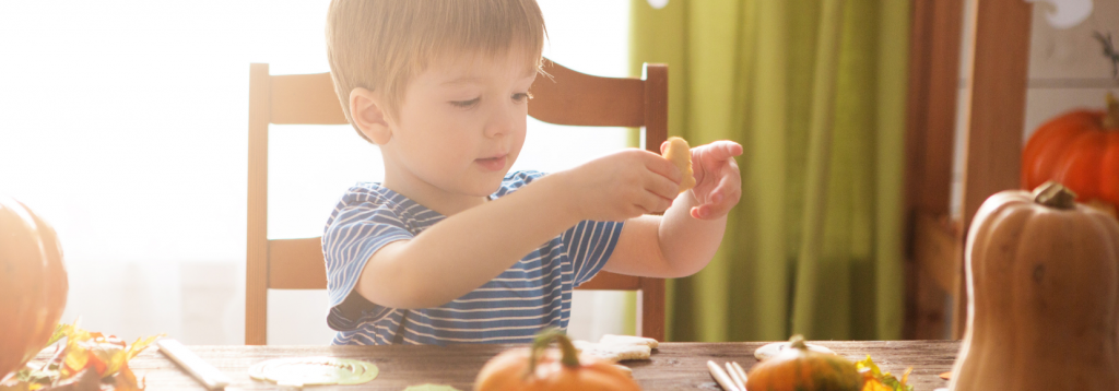 Child doing fun autumn crafts