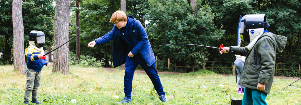 Premier Education coach teaching children how to fence correctly