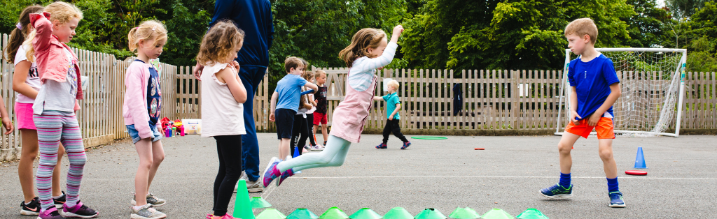 Easter Holiday Camps 2 Children doing athletics at a Premier Education Easter Holiday Camp