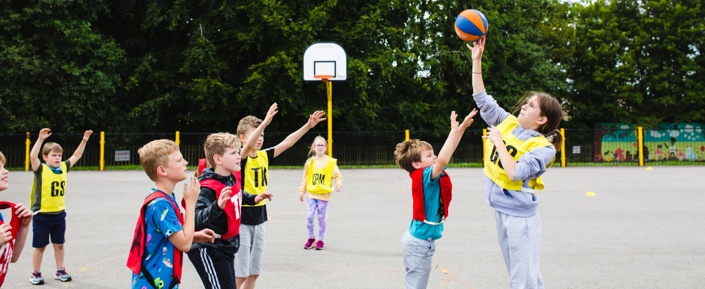 How to Keep Kids Active Over Winter 2 children enjoy netball winter team games with premier edcuation