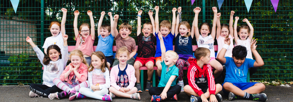 Children cheering at a Premier Education Holiday Camp