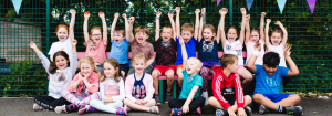 Children cheering at a Premier Education Holiday Camp