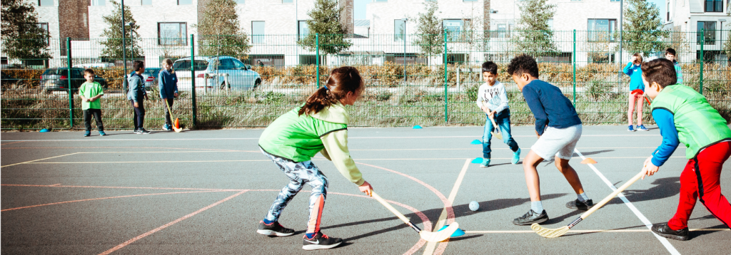 Holiday Camp FAQs 1 Children playing hockey at a Premier Education Holiday Camp 2