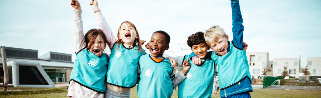 11 Summer Holiday Activities for Kids to Get Active 6 Children cheering at a Premier Education Holiday Camp 2