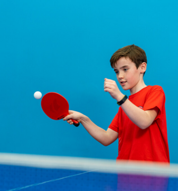 9 Sports to Try to Help Kids Stay Active Throughout the Year 6 Child playing table tennis