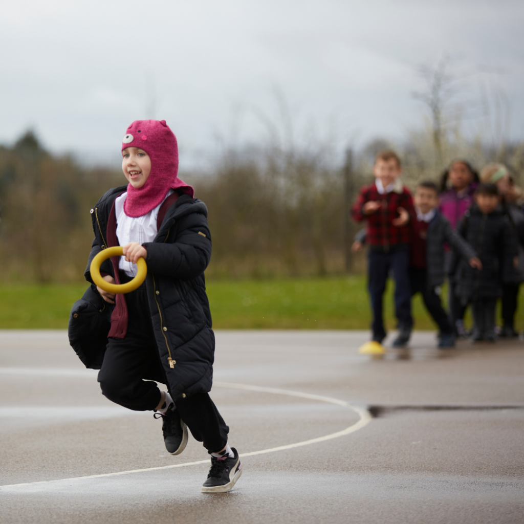How to Get Your Pupils Involved In National Schools Sports Week 3 Girl running with ring