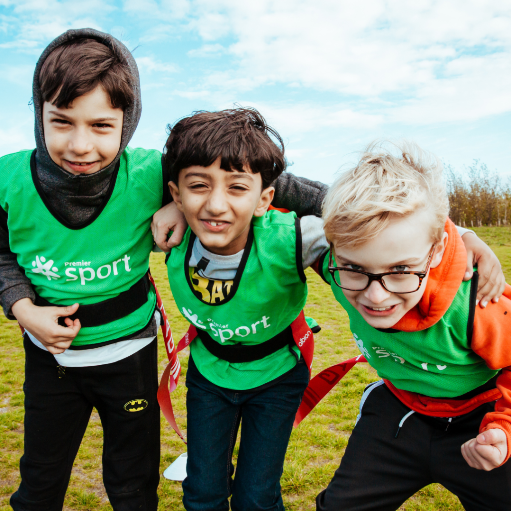 How to Get Your Pupils Involved In National Schools Sports Week 2 three boys enjoying Premier Education tag rugby