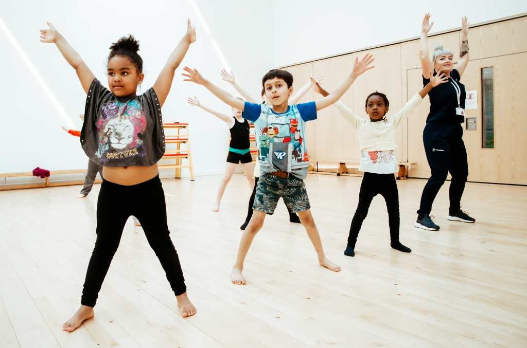 Is Dance a Sport? The Benefits for Kids 3 Pupils dancing with a Premier Education activity professional during a dance class
