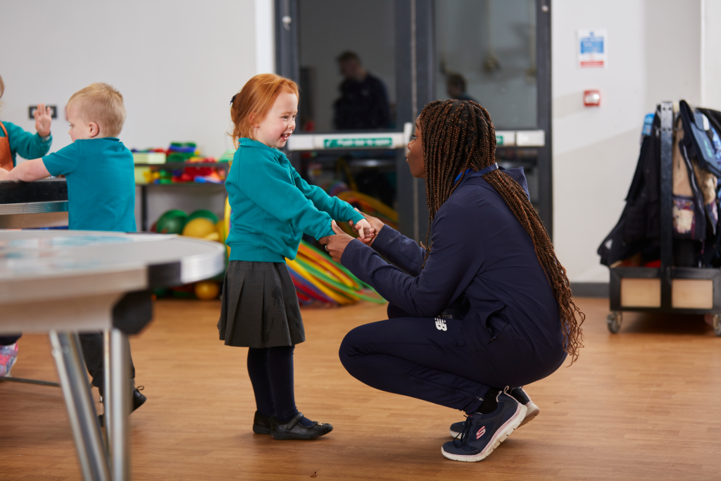 Premier Education activity professional playing with a child