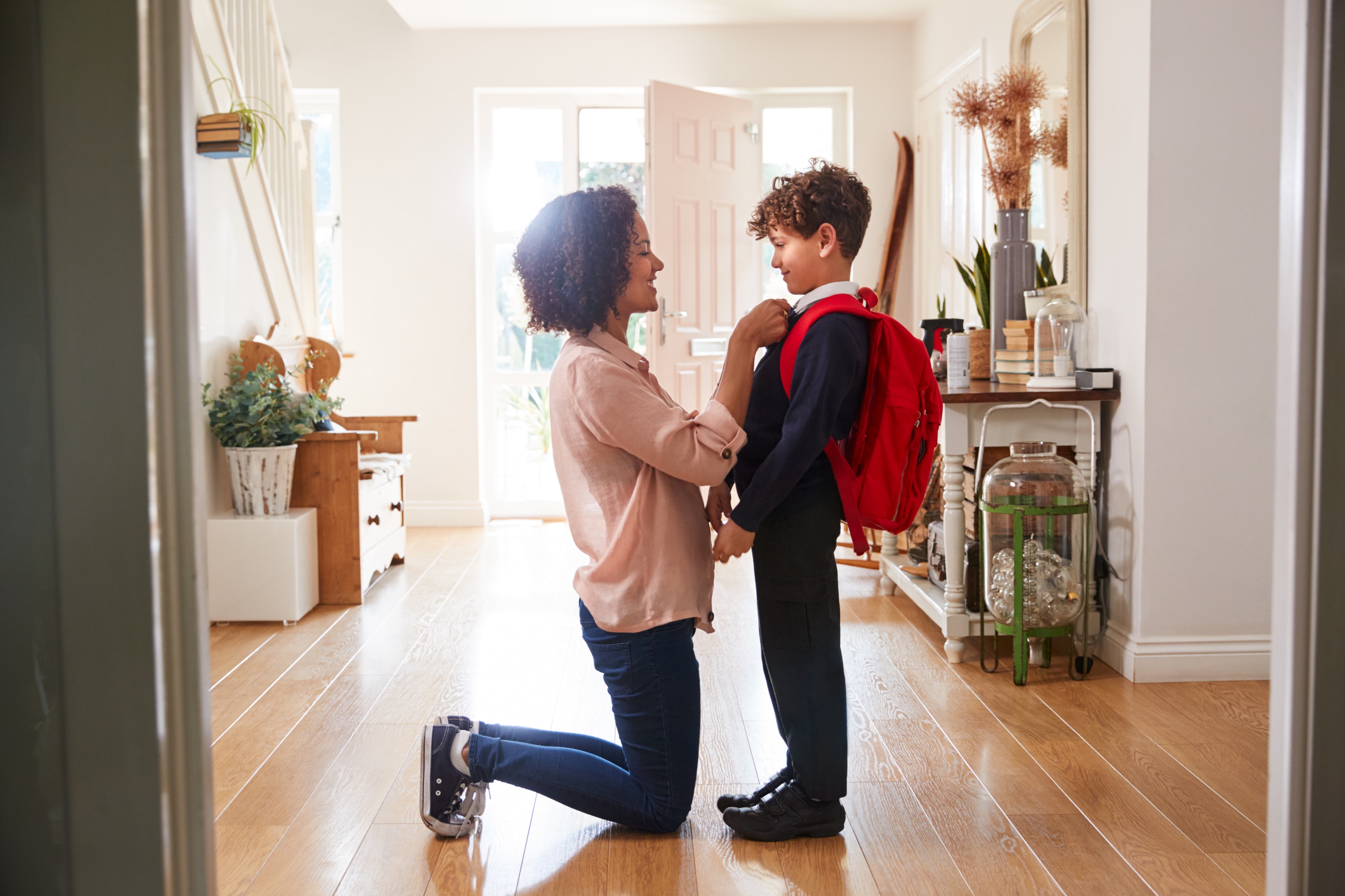 Reducing parental stress with wraparound care 3 Mum getting child ready for school in the morning