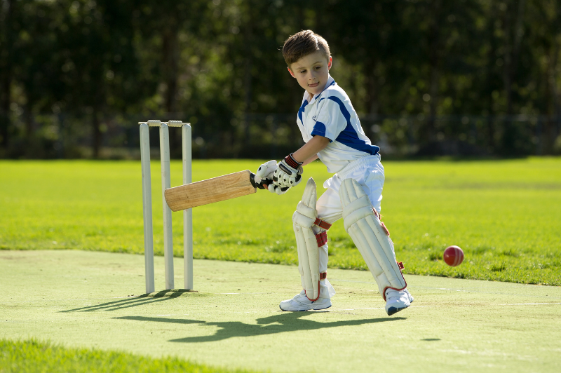 Child playing cricket