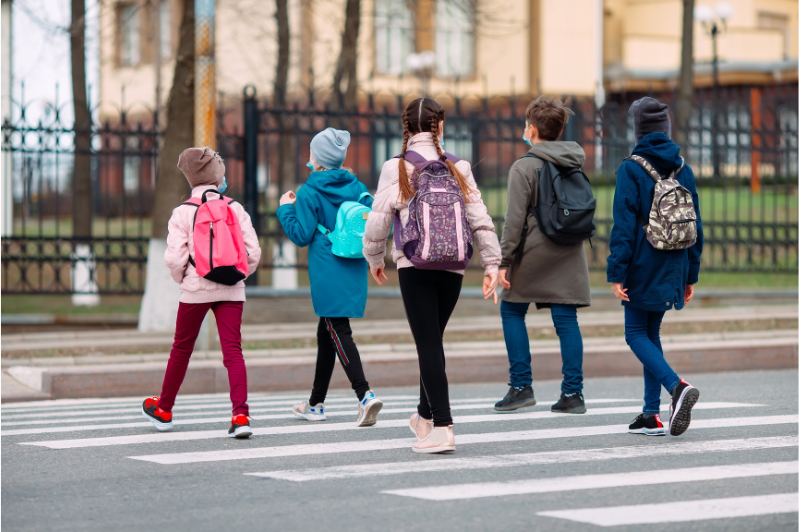 group of children crossing the road