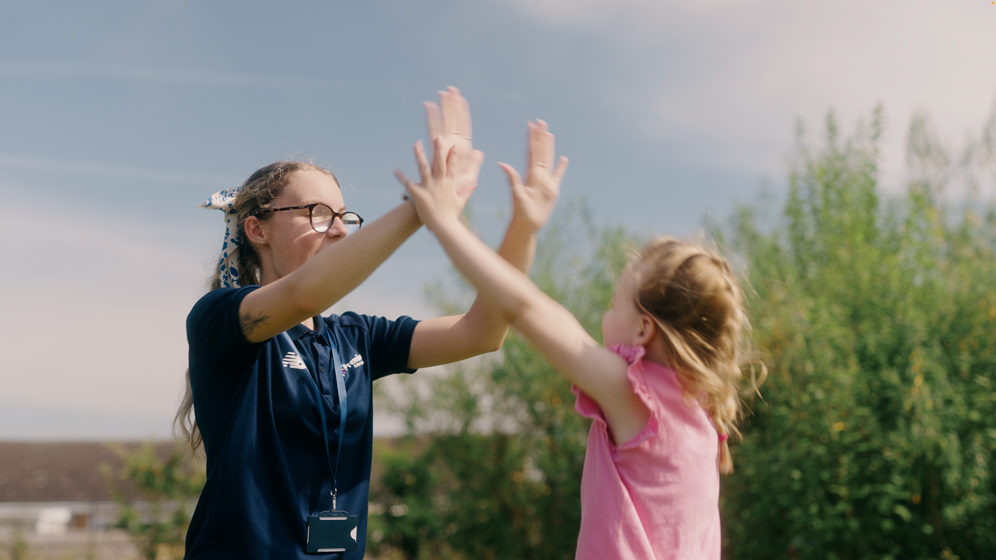 Top tips for teaching primary PE from the experts 3 coach engaging with child