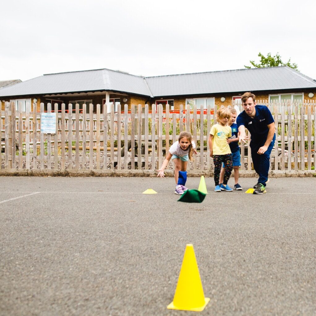 Children playing throwing games with help with hand-eye coordination