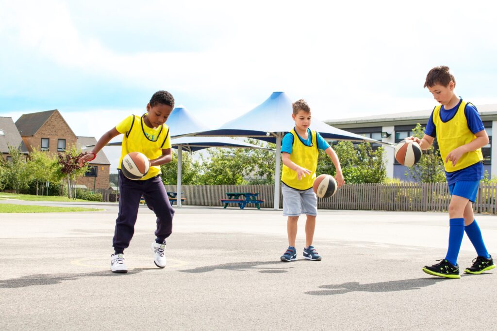 Children playing with basketballs